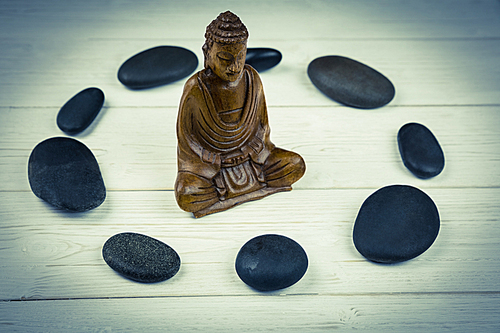 Buddha statue with stone circle shot in studio