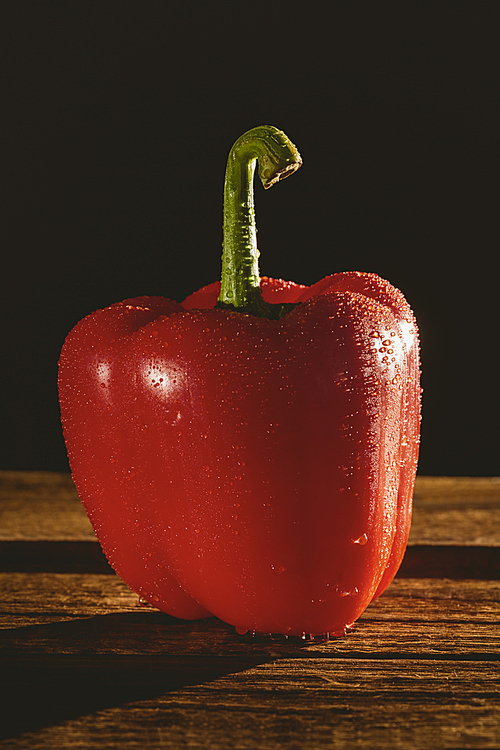 Red pepper on chopping board with copy space