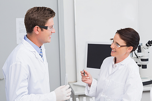 Scientists smiling at each other