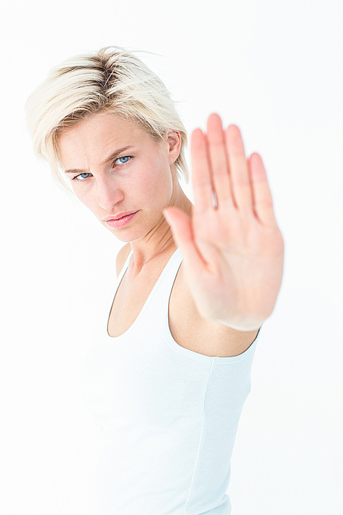 Angry pretty blonde showing her hand