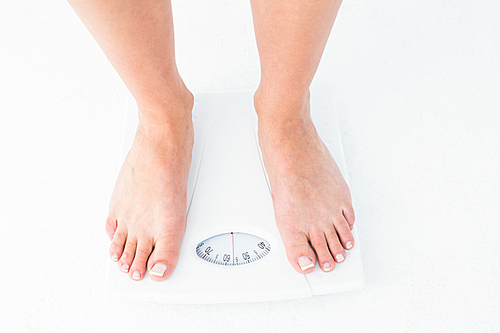 Woman standing on the scales