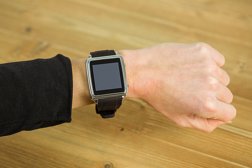 Businesswoman with smart watch on wrist