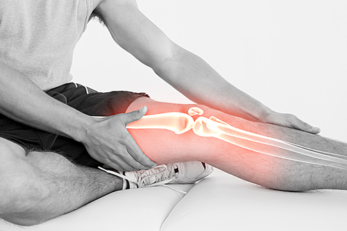 Digital composite of Highlighted knee of injured man