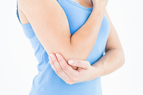 Woman touching her painful elbow on white background