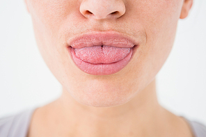 Woman with luscious lips on white background