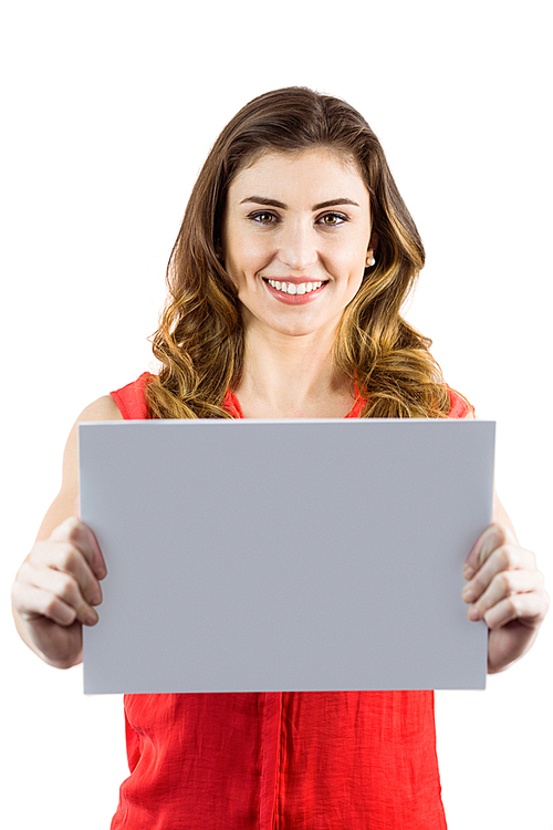 Pretty brunette showing a card on white background