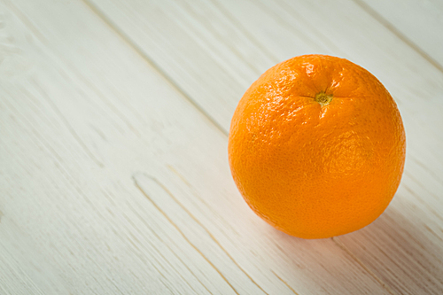 Fresh orange on wooden background