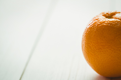 Fresh orange on wooden background