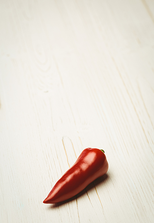 Red chili on wooden background