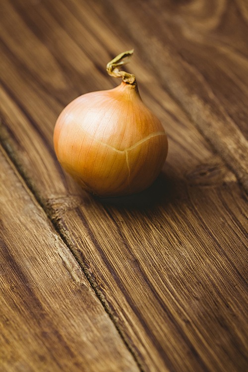 Fresh onion on wooden background