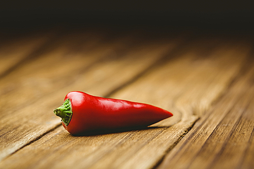 Red chili on wooden background