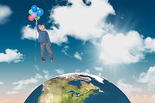 Composite image of cute boy holding balloons