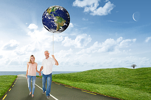 Composite image of happy couple walking holding hands