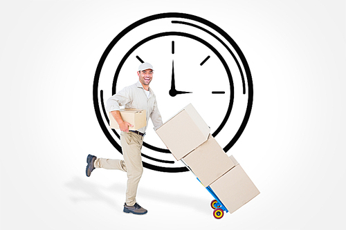 Composite image of happy delivery man with trolley of boxes running on white background