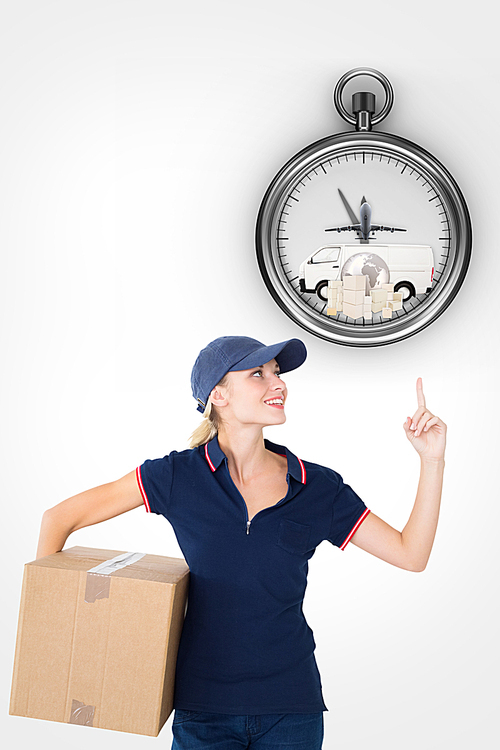 Composite image of happy delivery woman holding cardboard box and pointing up