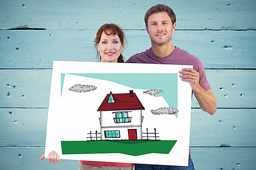 Composite image of couple holding a white sign