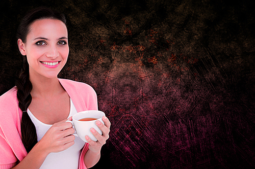 Composite image of pretty brunette holding a mug