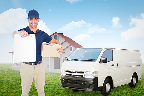 Composite image of delivery man with package giving clipboard for signature
