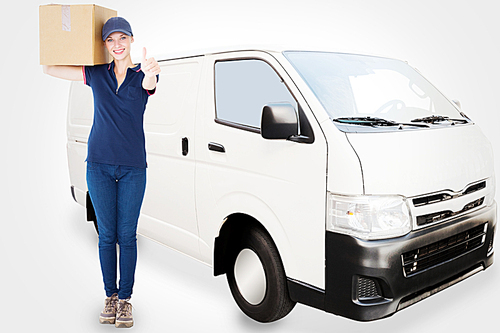 Composite image of happy delivery woman holding cardboard box