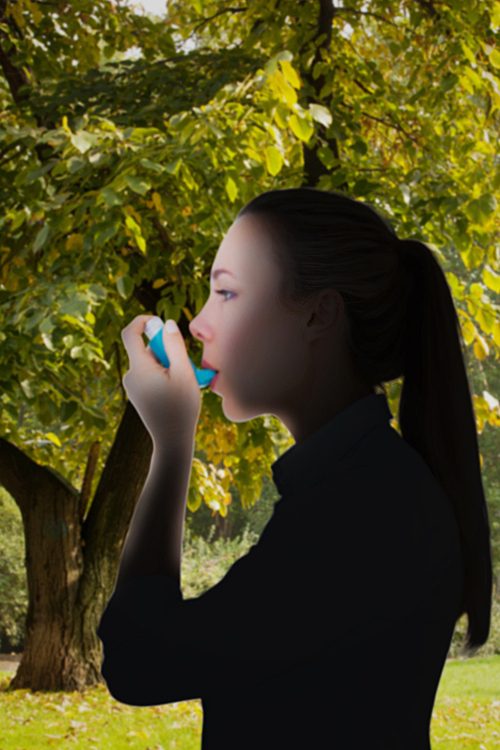 Composite image of beautiful blonde using an asthma inhaler