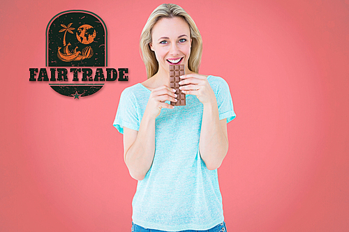 Composite image of smiling blonde eating bar of chocolate