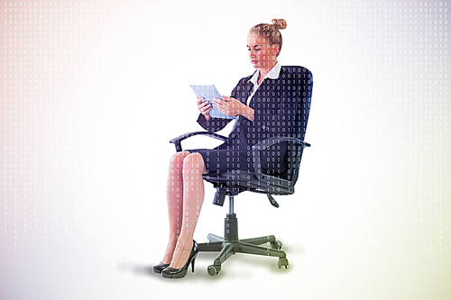 Composite image of businesswoman sitting on swivel chair with tablet