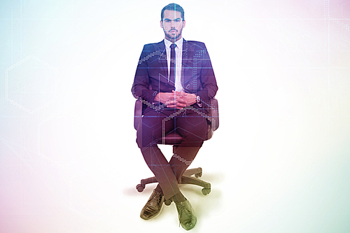 Composite image of stern businessman sitting on an office chair