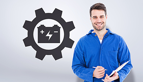 Composite image of smiling male mechanic writing on clipboard