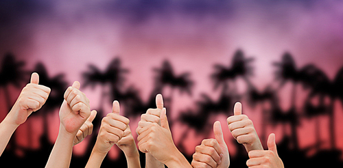 Composite image of group of hands giving thumbs up