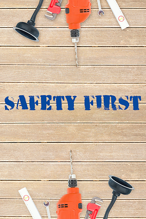 Safety first against tools on wooden background