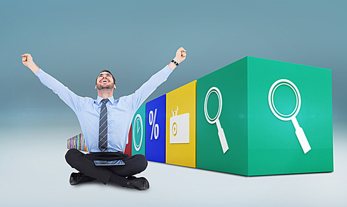 Composite image of businessman cheering with tablet sitting on floor