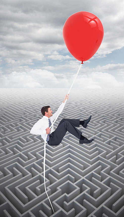 Composite image of businessman flying with balloon