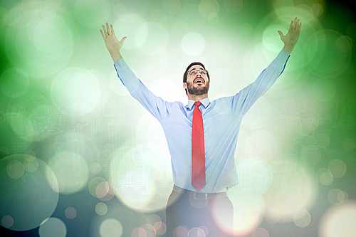 Composite image of happy cheering businessman raising his arms