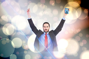 Composite image of businessman holding up reading glasses and calculator