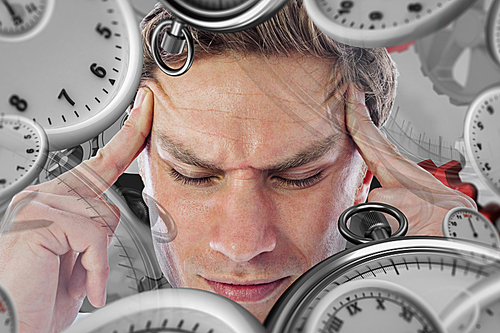 Composite image of businessman with a headache