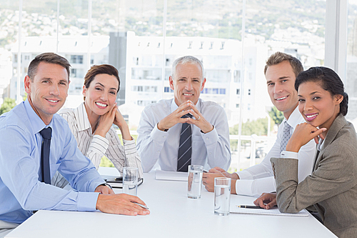 Business team smiling at camera