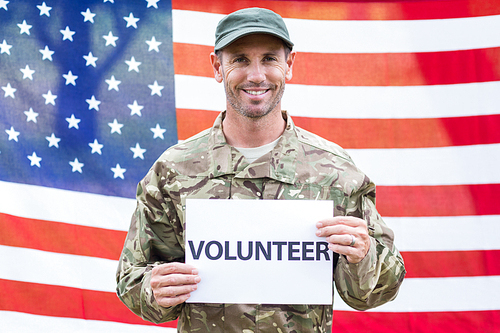 American soldier holding recruitment sign