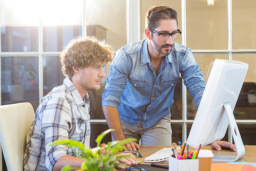 Concentrated business team working on computer