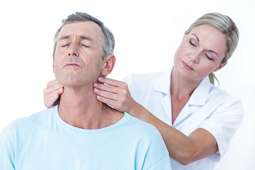 Doctor stretching her patient neck in medical office