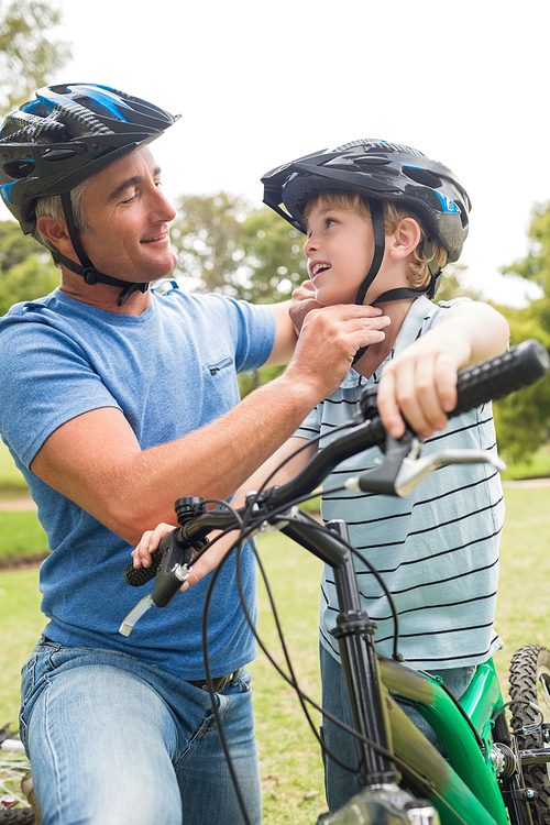 Father on a bike with his son on a sunny day