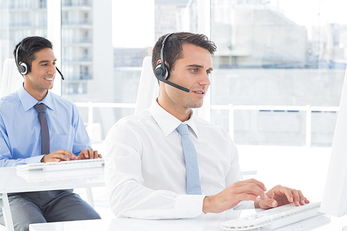 Concentrate work team using computer in office