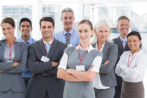 Business people  with arms crossed in office