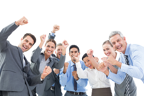 Business people cheering in office on white background