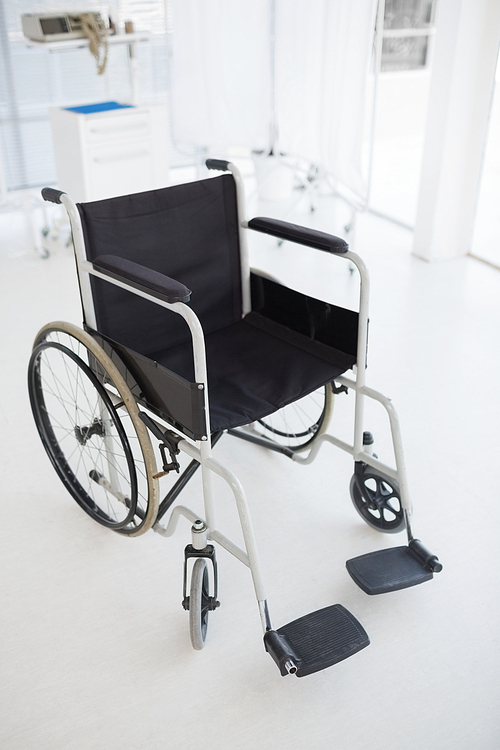 Composite image of black wheelchair in hospital