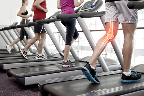 Digital composite of Highlighted knee of man on treadmill