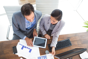 Businesswoman working with team mate in an office