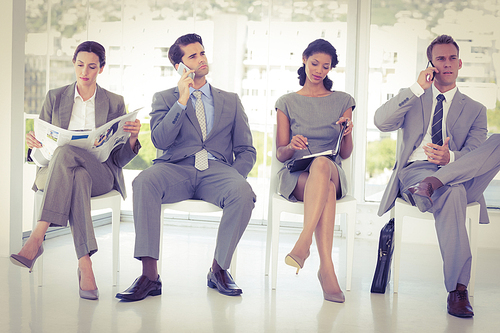 Business people sitting and waiting in the office