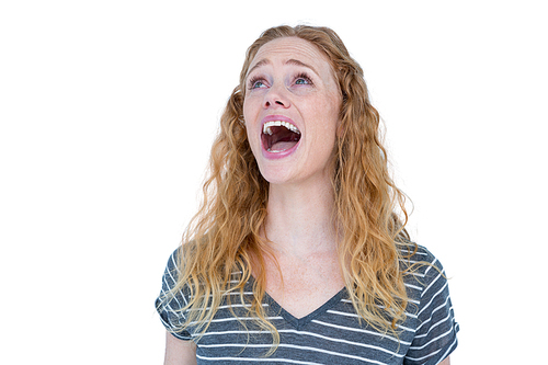 Pretty blonde standing and screaming on white background