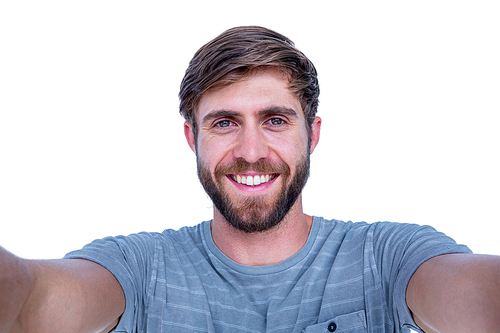 Handsome man smiling at camera on white background