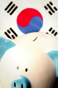 Piggy bank against korea republic national flag